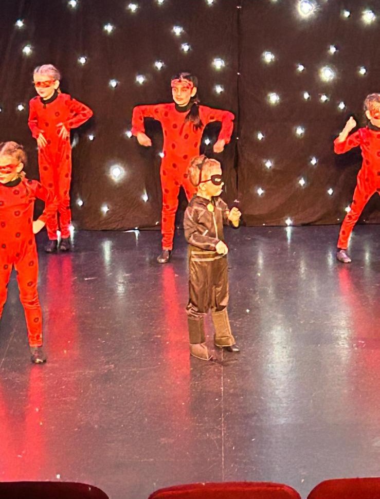 Smiling young students in acro class during annual show